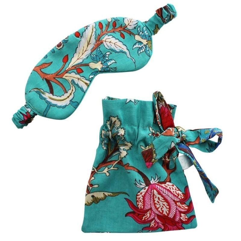 Powell Craft Teal Exotic Flower Print -unimaski ja sen pussukka samasta kankaasta valkoisella taustalla.