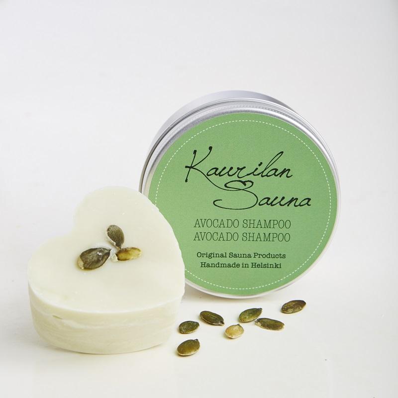 Kaurilan saunan 90 gramman avokado-palashampoo ja sen metallirasia, jossa on vihreä etiketti.