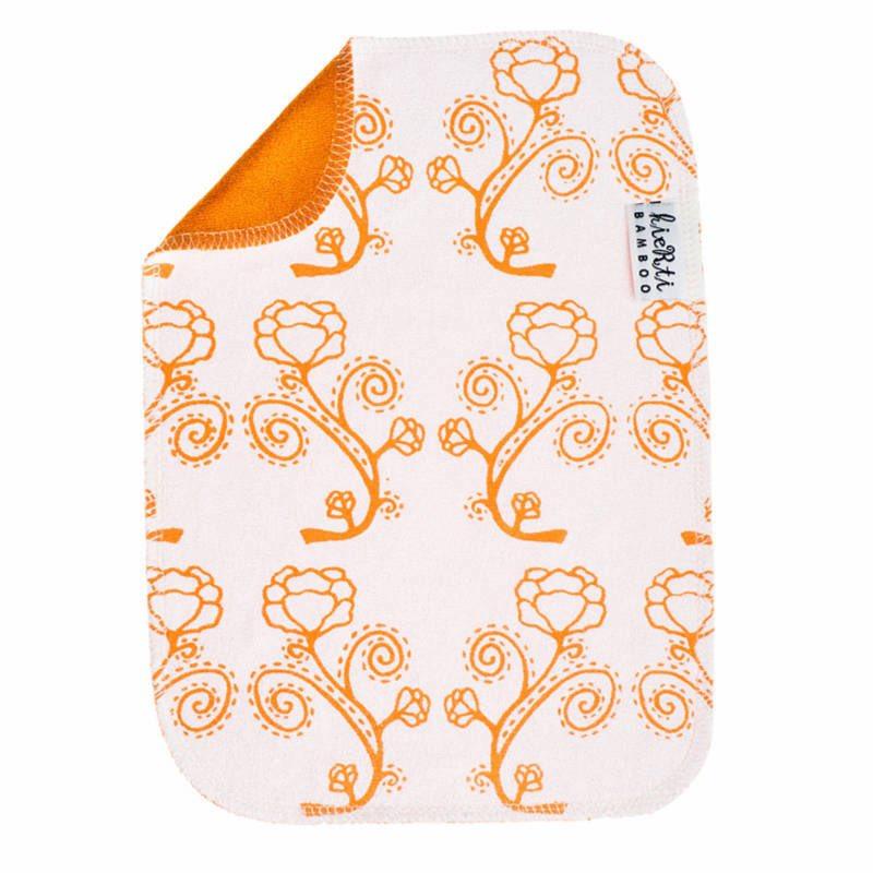 Kierti Bambuinen tiskirätti Rosaari sävyssä oranssi, jossa valkoisella pohjalla oranssireunaisia ruusukuvioita. Kääntöpuoli oranssi.