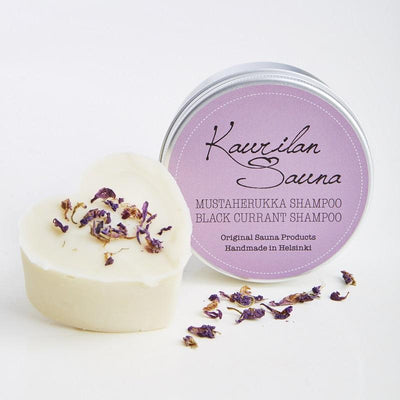 Kaurilan saunan MUSTAHERUKKA-PALASHAMPOO 90 g metallipurkissa, jossa on liila etiketti.